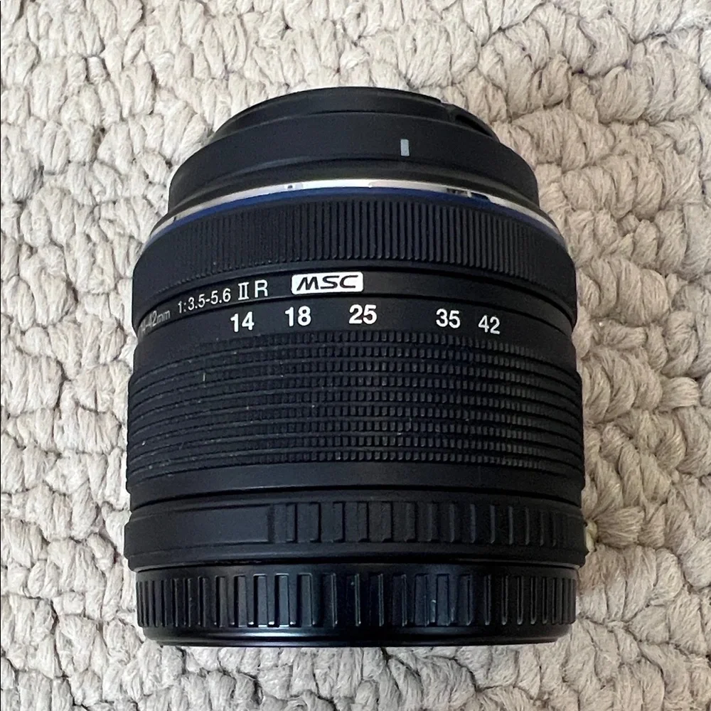 Olympus Black and Silver Camera Lens